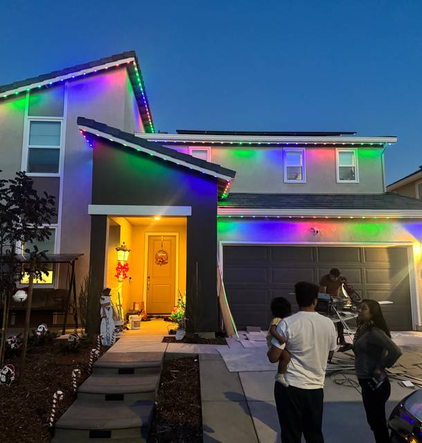 christmas lights installation on a house